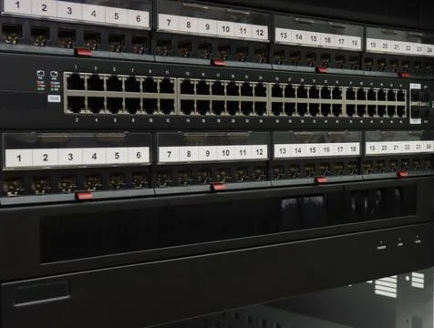 An Ethernet switch and patch panels. Stock Photos