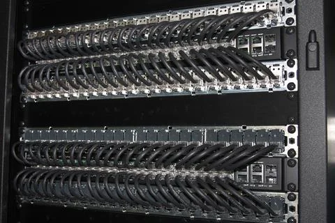 An Ethernet switch and patch panels. Stock Photos