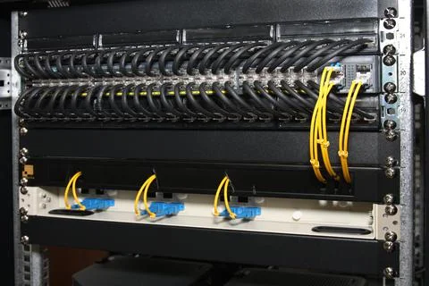 An Ethernet switch and patch panels. Stock Photos