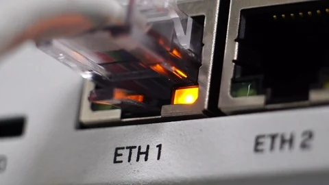 Ethernet switch. Close up. With cables, used and opened ports.  Stockbeeldmateriaal 125689263
