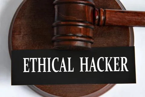 ETHICAL HACKER - words on a black sheet against the background of a judge's.. Stock Photos