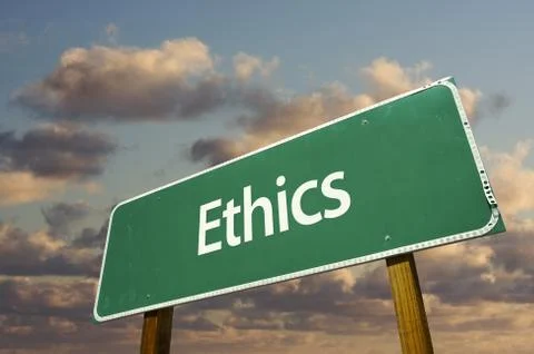 Ethics Green Road Sign with dramatic blue sky and clouds. Stock Photos