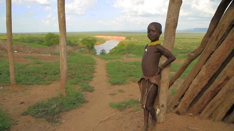 Ethiopian Boy Posing in Front of Beautiful Omo Valley Landscape Stock Footage 66354534