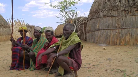 Ethiopian Elders From A Tribe Within The Omo Valley Sitting in Their Village Stock Footage 66354743