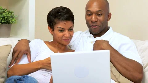 Ethnic Couple Talking to Friends Via Webchat Stock Footage 3678428