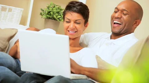 Ethnic Couple Using Laptop for Webchat Stock Footage 3019398