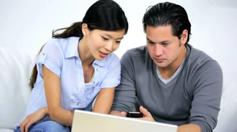 Ethnic Couple Using Wireless Laptop Trying Solve Financial Problems 動画素材 35177730