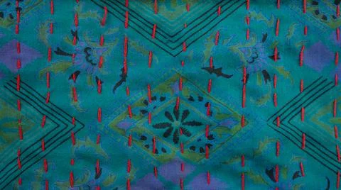 Ethnic fabric printed geometrical pattern on emerald and violet background Stock Photos