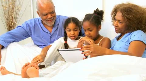 Ethnic Family Generations Using Wireless Tablet  Stock Footage 10882966