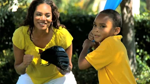 Ethnic Family Playing Baseball in Park Stock Footage