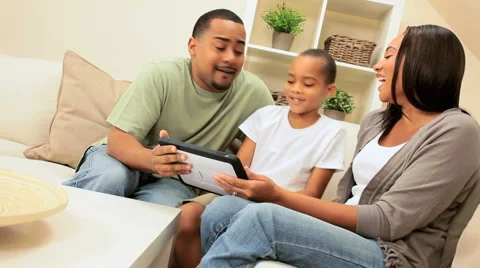 Ethnic Family Using Wireless Tablet Stock Footage 2976035