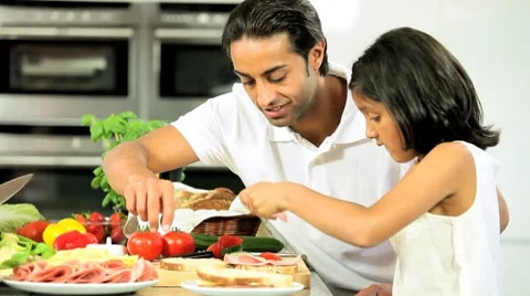 Ethnic Father & Daughter Preparing Food Stock Footage