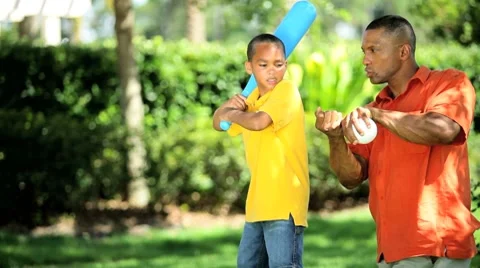 Ethnic Father Teaching Young Son Baseball Stock Footage