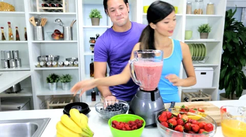 Ethnic Male Female Kitchen Blender Fresh Fruit Juice Stock Footage