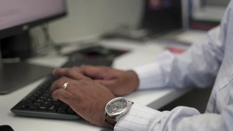 Ethnic Male Hands Typing on Computer Keyboard Stock Footage 138125836
