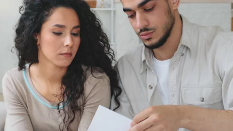 Ethnic multiracial multiethnic Indian Hispanic Latino frustrated married couple Stock Footage 219803984