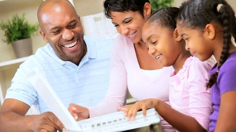 Ethnic Parents Watching Daughters Using Laptop Stock Footage 8974195