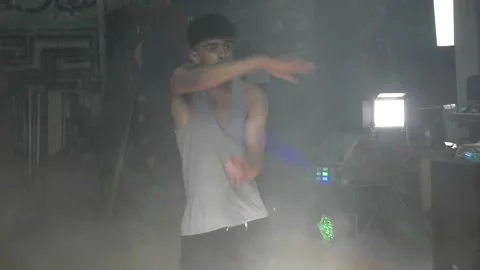 Ethnic young man dancing with hand jestures. 스톡 동영상 153027132