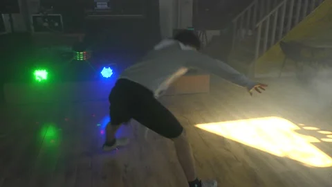 Ethnic young man dancing solo under lights Stock Footage 153026713