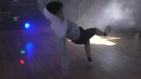 Ethnic young man dancing solo with smoke. Stock Footage 153026971