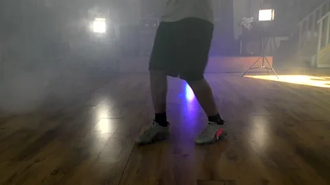 Ethnic young man dancing solo showing foot routine. Stock Footage 153030041
