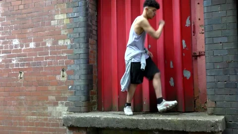 Ethnic young man dancing solo outside. Stock Footage 153030860