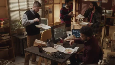 Ethnically Diverse Geeks Having Lunch at Workplace Stock Footage 263309905