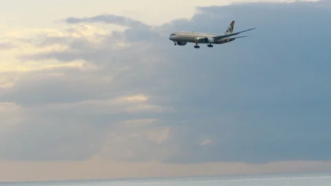 Etihad Airways Boeing 787-9 approach over beach in Phuket Stock Footage 342883069