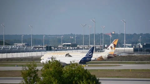 Etihad Ariways and Lufthansa passenger airplane taxiing at Munich Airport Stock Footage 164951835