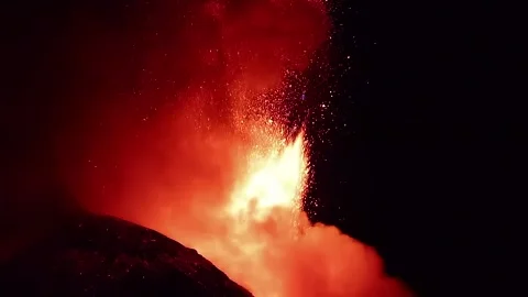 Etna volcano Eruption with great lava explosion in the night background Stock Footage 312703839