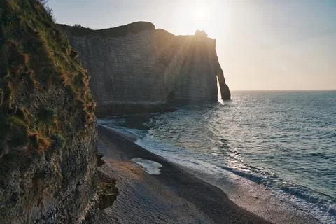 Etretat and sun rays Stock Photos