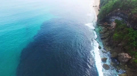 Etretat Aval cliff, rocks and natural arch landmark and blue ocean. Aerial view Stock Footage 59742564