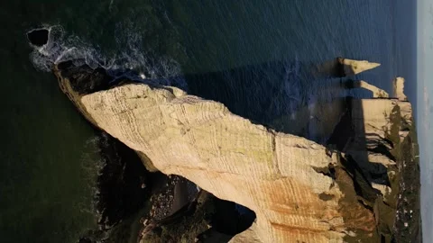Etretat Cliffs, Alabaster Coast, Normandy, France.  Aval Arch, 4k Aerial view Stock Footage 259823841