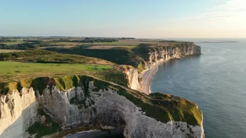 Etretat Drone aerial view of dramatic white chalk cliffs, golden hour light Stock Footage 346477176