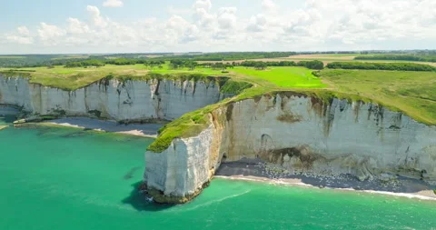 Etretats iconic chalk cliffs on a beautiful summer day, slow camera pan, 4k Stock Footage 247647422