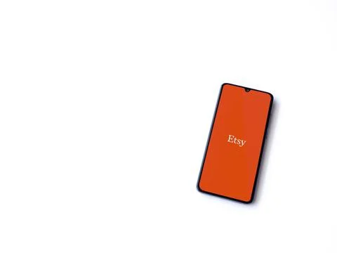 Etsy app launch screen on smartphone on white background Stock Photos