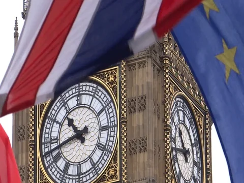 EU and UK flags are waving in front of Big-Ben, London, UK Video stock 75536483