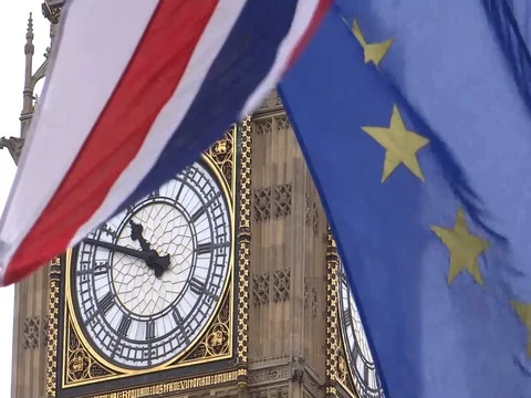 EU and UK flags are waving in front of Big-Ben, London, UK Video stock 75536650