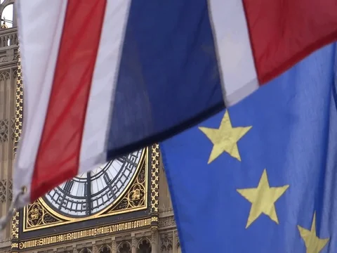 EU and UK flags are waving in front of Big-Ben, London, UK Video stock 75642847
