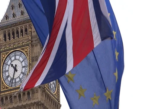 EU and UK flags are waving in front of Big-Ben, London, UK Video stock 75642849