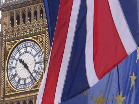EU and UK flags are waving in front of Big-Ben, London, UK Video stock 75642856