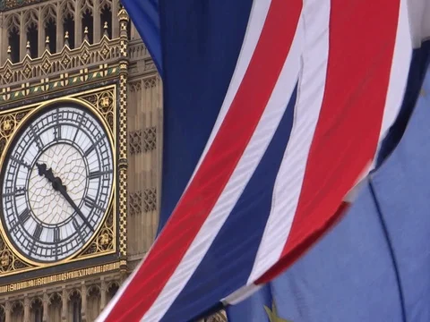 EU and UK flags are waving in front of Big-Ben, London, UK Video stock 75642857