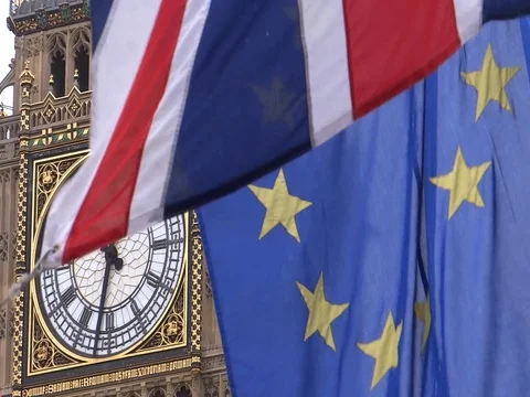 EU and UK flags are waving in front of Big-Ben, London, UK Video stock 75642860