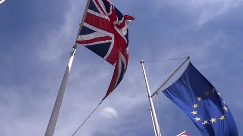 EU and UK flags in the blue sky Stock Footage