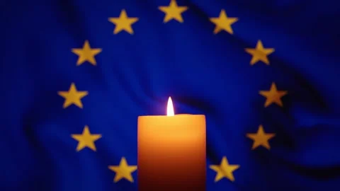 EU flag and burning candle. Tragedy and mourning. Grief for the dead people. Video stock 254535758
