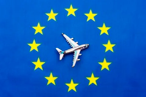 EU flag and the plane. The concept of travel. Stock Photos