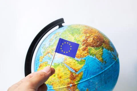 EU flag on a background of globe Stock Photos