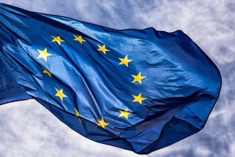 EU Flag, European Union flag on blue sky background Stock Photos
