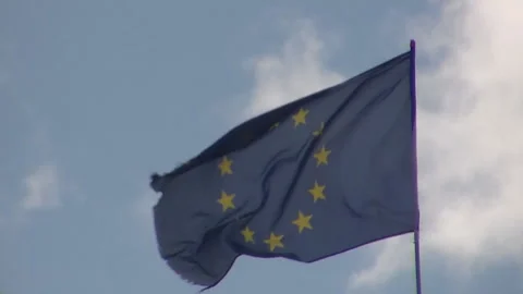 EU Flag Flies Against the Sky, against the Sunny Sky, the European Union. Stock Footage 92571331