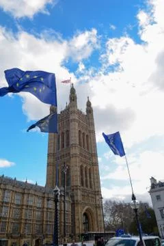 E.U. Flag flying in front of Union ack flag at Houses of Parliament London Stock Photos